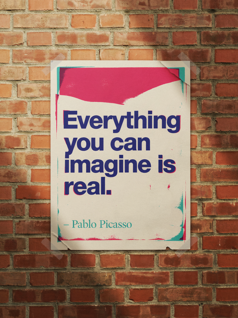 Cream risograph poster with a pink ink band pasted on a sunlit brick wall, reading Everything you can imagine is real – Pablo Picasso in bold navy letters