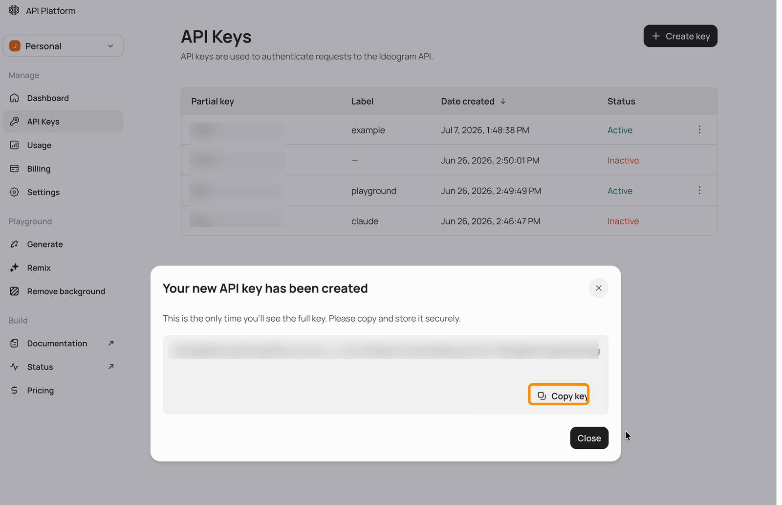 Dialog confirming a new API key has been created, with the full key value obscured and the Copy key button highlighted